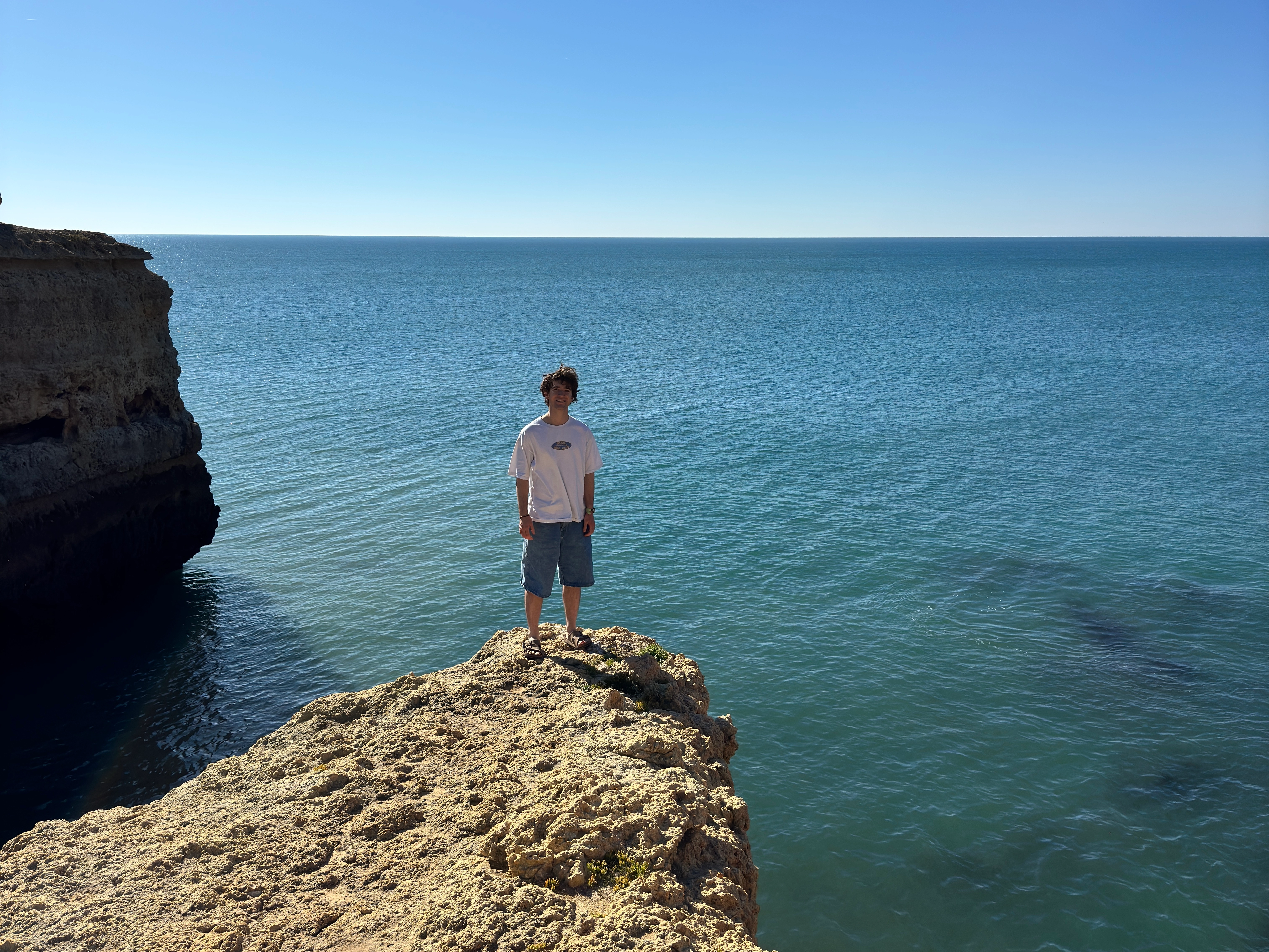 me at a sea cliff in Portugal